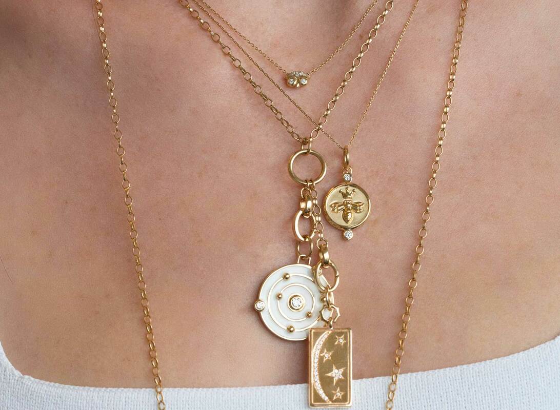 Get inspired to create your own neck mess with some of our favorite Monica Rich Kosann charm pieces