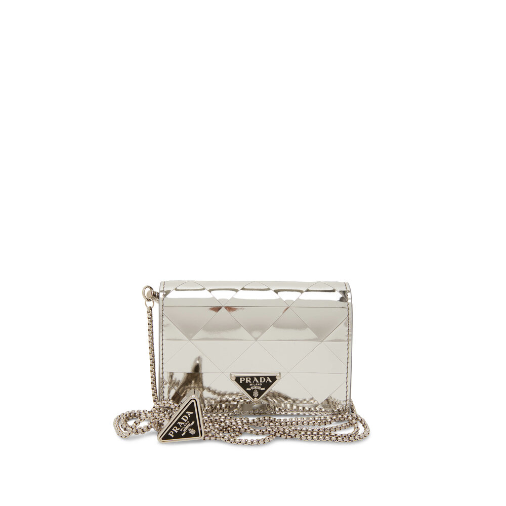 A rhinestone-covered cardholder with chain by Prada, 202…